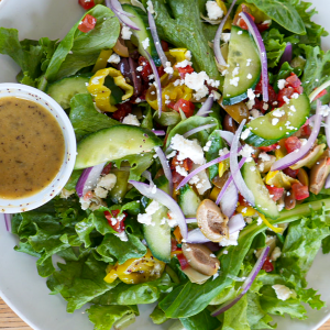 Romaine mix, artichoke, sundried tomato, olive medley, pepperoncini, feta cheese, fresh cucumber, fresh tomato, and tangy Greek dressing. **contains dairy**